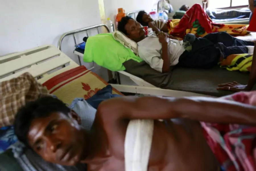 Rohingya men who were shot by the police during a riot on Friday rest in Dapaing district clinic, outside of Sittwe, on August...third time in two months, reviving tensions in a region beset by religious violence last year. (Soe Zeya Tun/Courtesy Reuters)