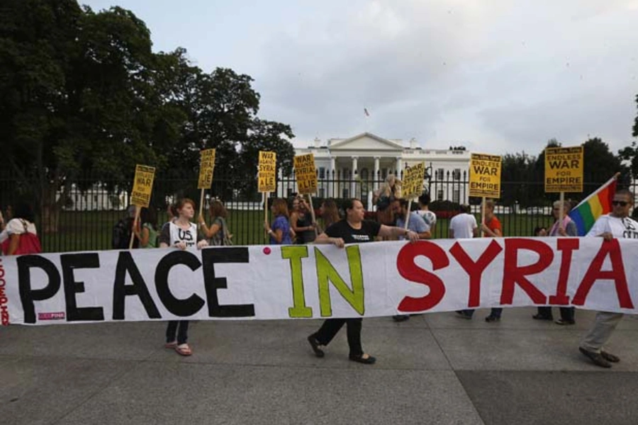 Opponents of U.S.-led intervention in Syria rally outside the White House (Jason Reed/Courtesy Reuters).