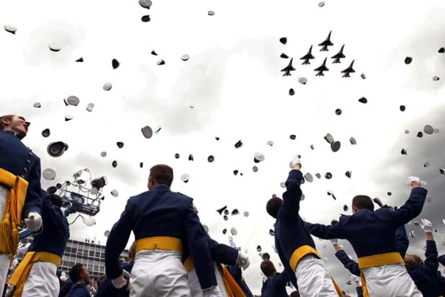 The Thunderbirds fly past as graduates celebrate at the Air Force Academy commencement ceremony in Colorado Springs (Kevin Lamarque/Courtesy Reuters).