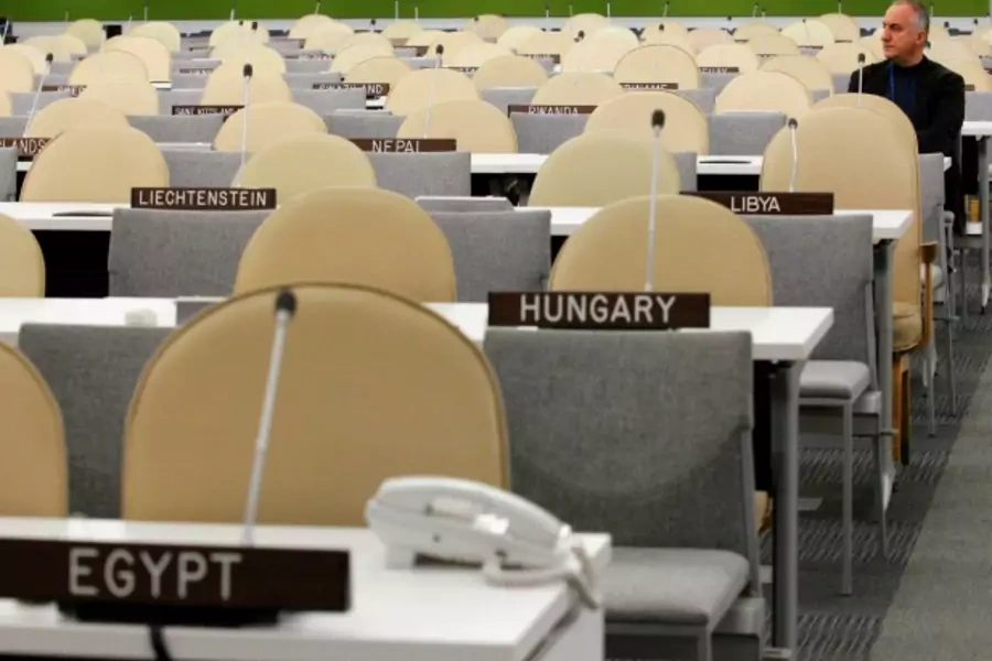 A UN worker rests after checking the temporary General Assembly Hall at the UN headquarters in New York, September 22, 2013 (Courtesy Reuters/Eduardo Munoz).