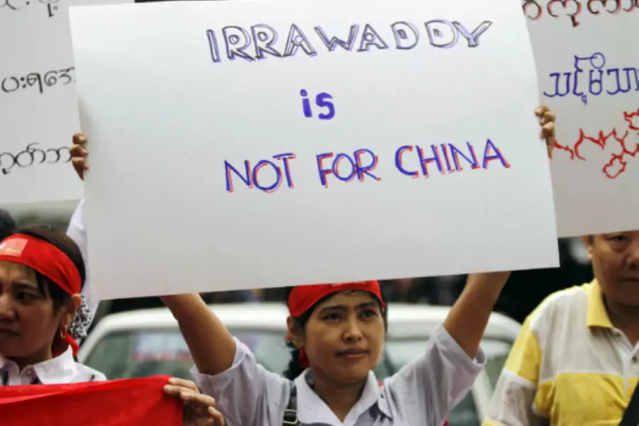 Myanmareses living in Malaysia display placards in protest against the Myitsone dam project, outside Myanmar embassy in Kuala Lumpur on September 22, 2011. (Bazuki Muhammad/Courtesy Reuters)