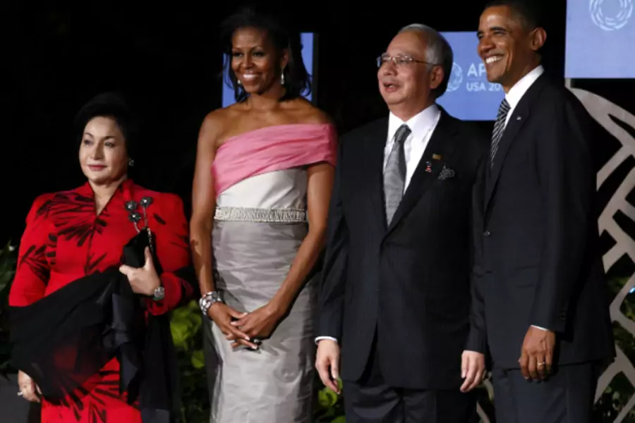 U.S. President Barack Obama and first lady Michelle Obama greet Malaysia's Prime Minister Najib Razak and his wife Rosmah Mans...Honolulu, Hawaii on November 12, 2011. President Obama will be visiting Malaysia in October 2013. (Jim Young/Courtesy Reuters)