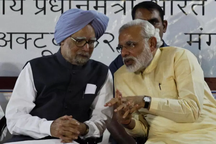 Indian Prime Minister Manmohan Singh (L) speaks with Gujarat's chief minister and Hindu nationalist Narendra Modi, the prime m...ardar Vallabhbhai Patel national museum in the western Indian city of Ahmedabad October 29, 2013 (Amit Dave/Courtesy Reuters).