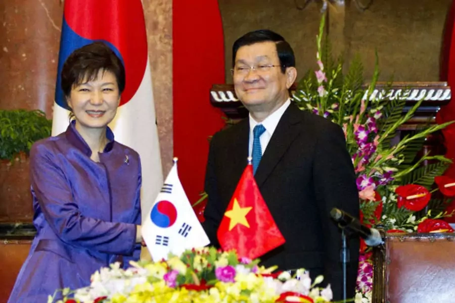 South Korea's President Park Geun-hye (L) shakes hands with her Vietnamese counterpart Truong Tan Sang after a news briefing at the Presidential Palace during her official visit in Hanoi on September 9, 2013. (Luong Thai Linh/courtesy Reuters)