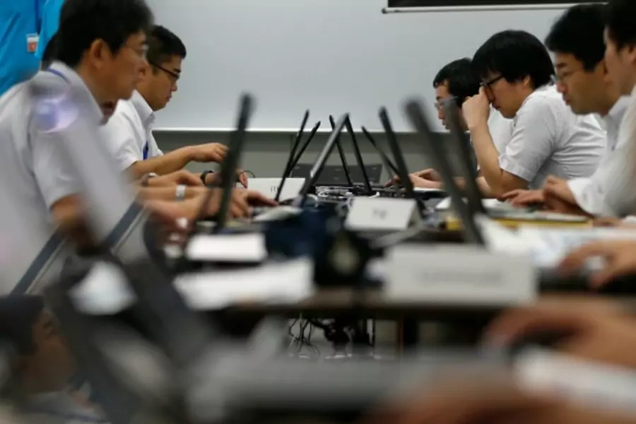 Participants from government ministries and agencies take part in the Cyber Defense Exercise with Recurrence (CYDER) in Tokyo on September 25, 2013. (Toru Hanai/Courtesy Reuters)
