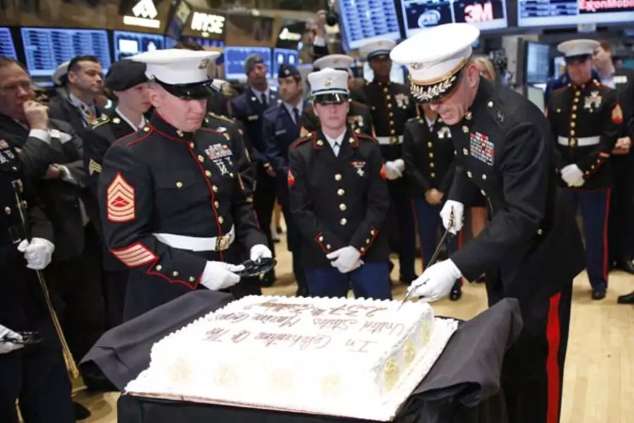 U.S. Marine Corps Major General Michael Dana uses a saber to slice a cake for the Marines' 237th birthday (Chip East/Courtesy Reuters).