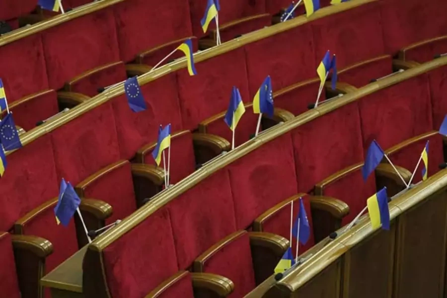Ukrainian and EU flags are displayed before a session of the Ukrainian parliament in Kiev on November 21, 2013 (Gleb Garanich/Courtesy Reuters).