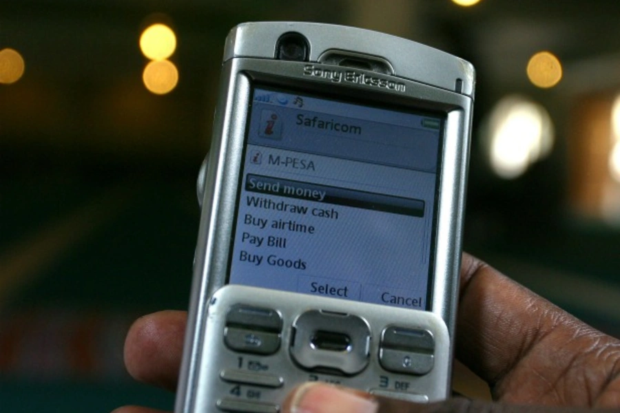 A man uses the M-PESA mobile banking system in Nairobi, Kenya, May 2009 (Courtesy Reuters/Noor Khamis).