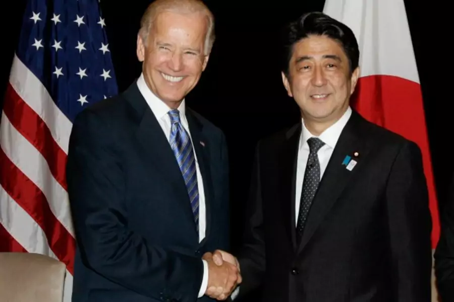 U.S. Vice President Joe Biden shakes hands with Japan's Prime Minister Shinzo Abe (R) during their bilateral meeting in Singapore on July 26, 2013 (Tim Chong/Courtesy Reuters).