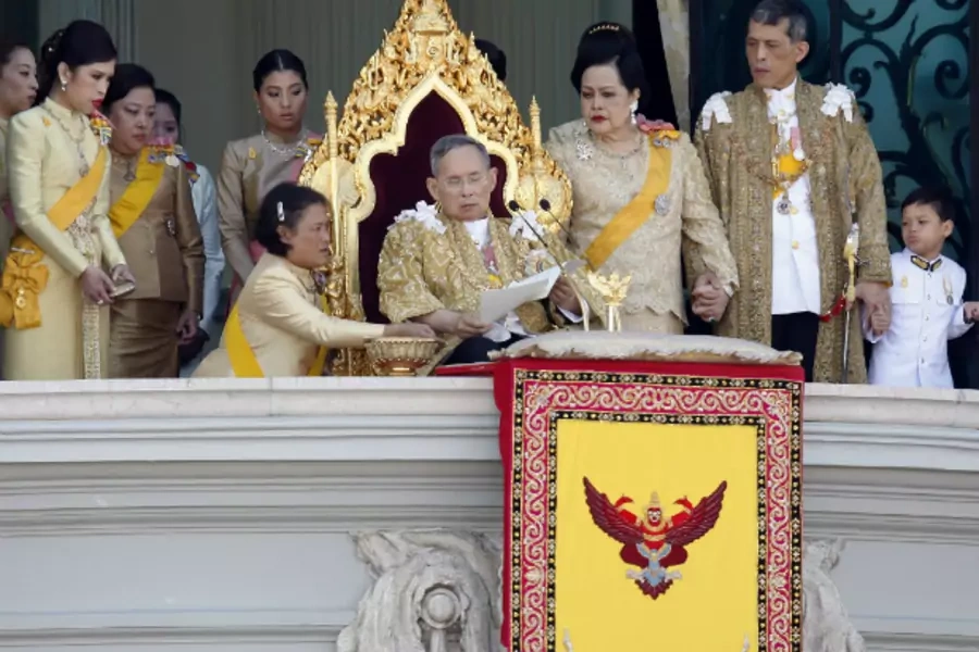 Princess Maha Chakri Sirindhorn assists Thailand's King Bhumibol Adulyadej as he delivers his birthday speech from the balcony... Maha Vajiralongkorn, Princess Chulabhorn and other members of royal family in Bangkok on December 5, 2011. (Courtesy Reuters)