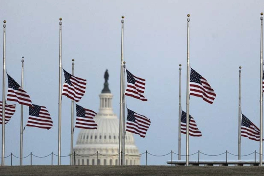 American flags fly at half mast. (Jonathan Ernst/Courtesy Reuters)