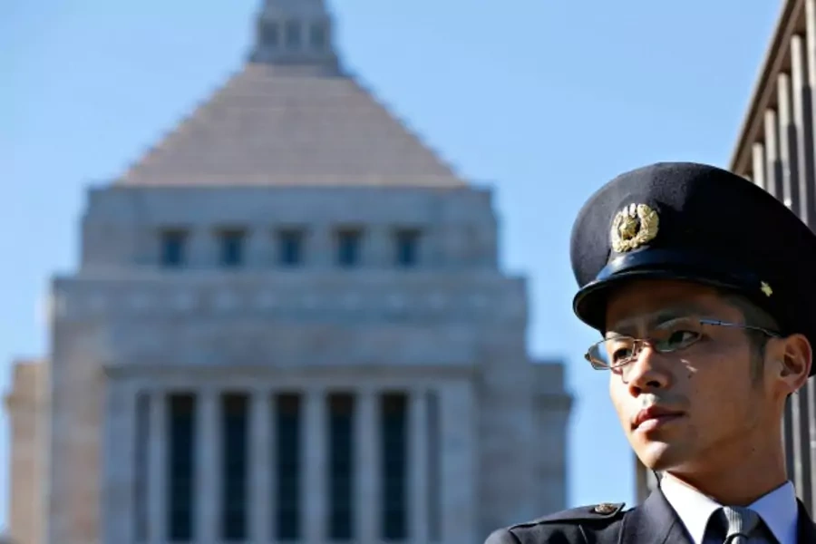 A Diet guard stands guards in front of the parliament building in Tokyo on December 26, 2012. (Yuriko Nakao/Courtesy Reuters)
