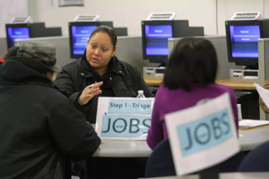 Case worker Jessica Yon discusses job eligibility for unemployed people at a jobs center in San Francisco, California (Robert Galbraith/Courtesy Reuters).