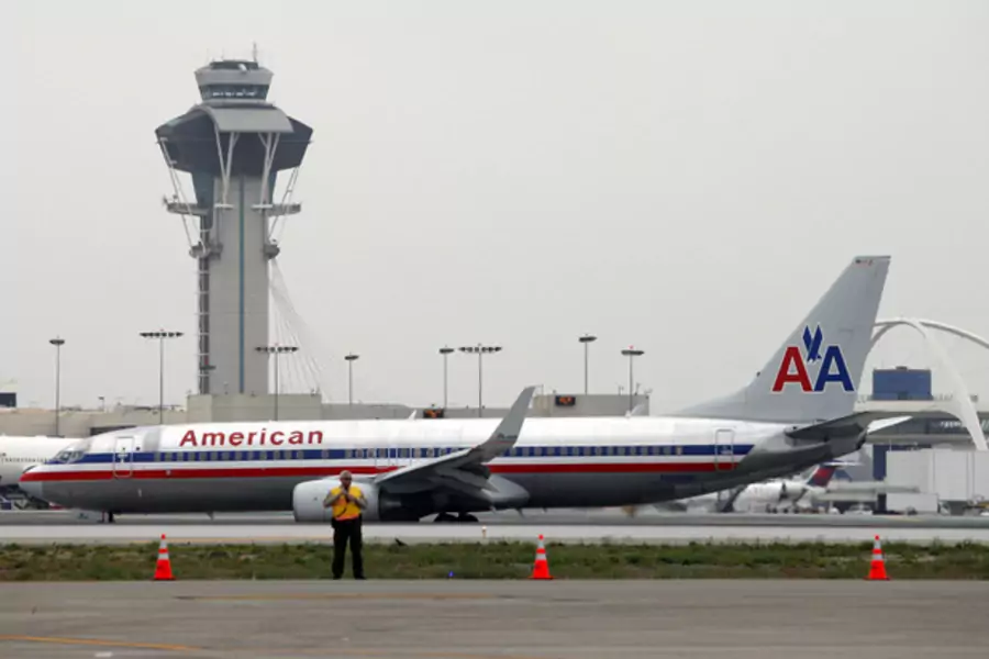 An American Airlines jet passes the air traffic control tower on the runway at Los Angeles International Airport (LAX), California (Patrick T. Fallon/Courtesy Reuters).