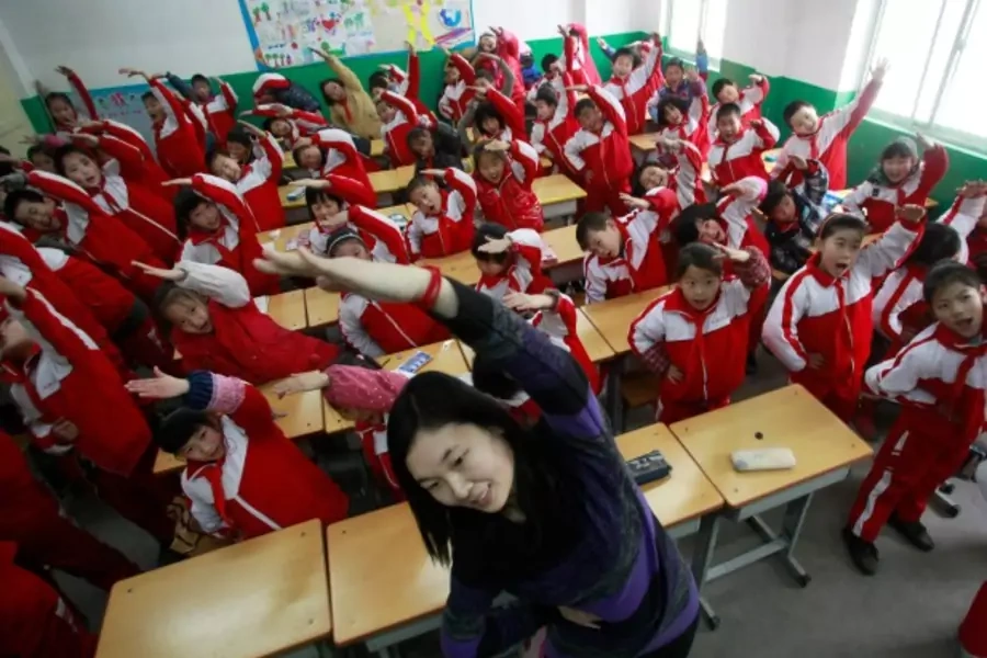 A teacher leads her students in an exercise, Jinan, China, January 2013 (Courtesy Reuters/China Daily).