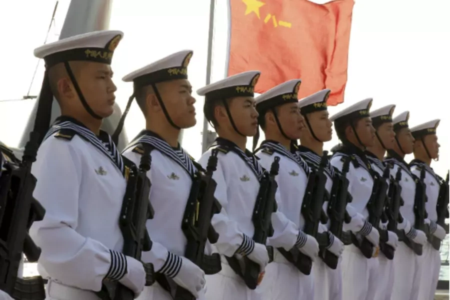Chinese sailors stand at attention on the helipad of the Chinese frigate Yancheng docked at Limassol port on January 4, 2014. (Andreas Manolis/Courtesy Reuters)