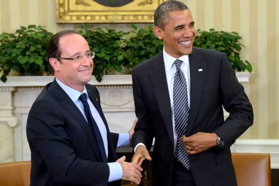 U.S. president Barack Obama shakes hands with French president Francois Hollande after a meeting in the Oval Office in 2012. (Eric Feferberg/Courtesy Reuters)