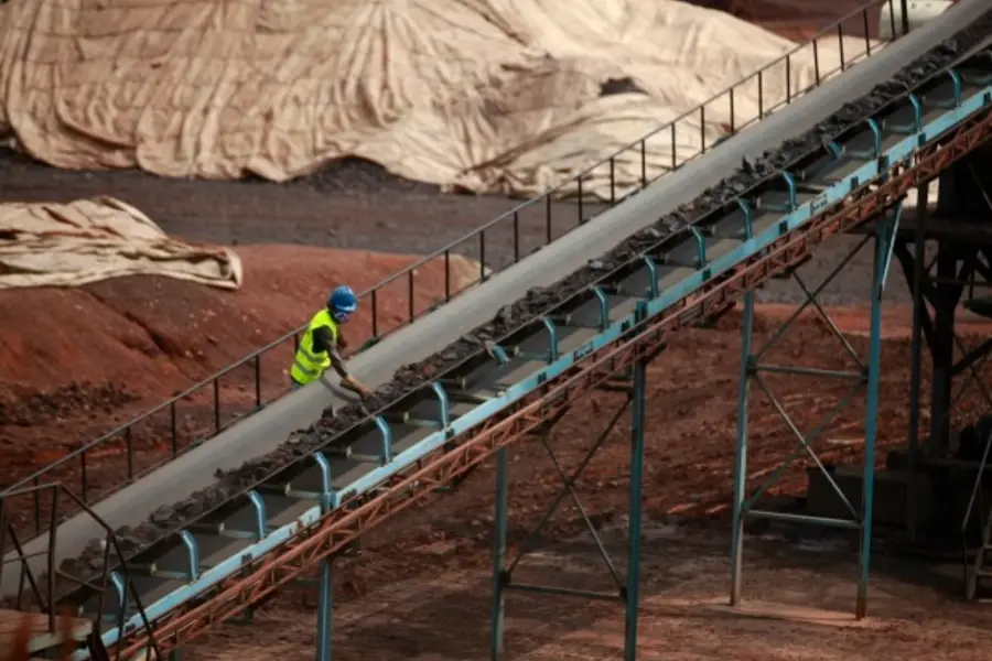 A worker works at the Lauzoua manganese mine, supported by investment from the China National Geological and Mining Corporation, in the Ivory Coast on December 4, 2013. (Theirry Gouegnon/Courtesy Reuters)