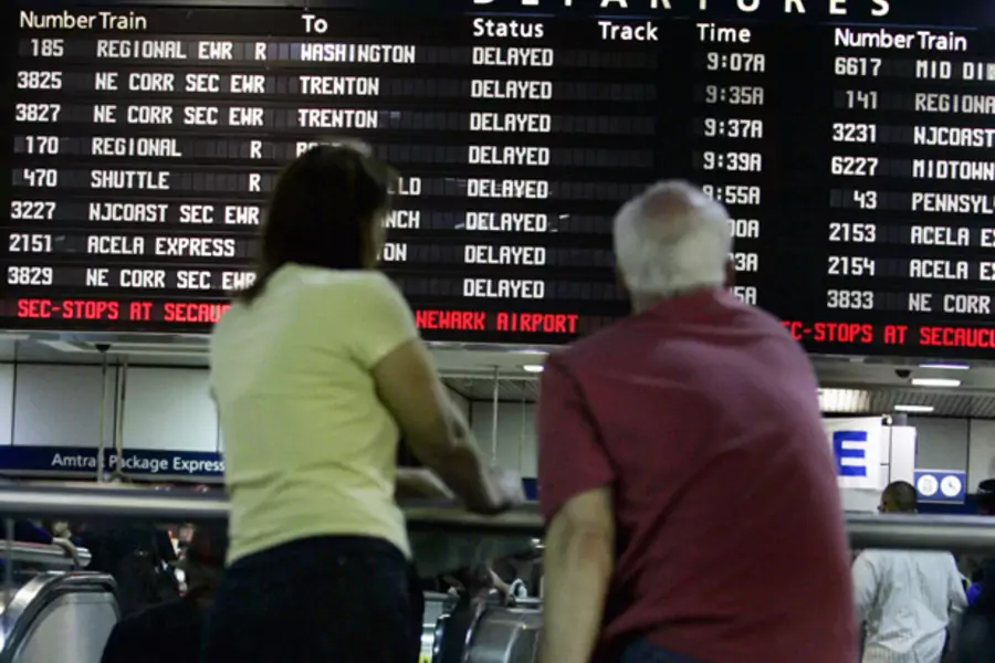 Passengers wait for a train at New York's Penn Station. (Shannon Stapleton/Courtesy Reuters)