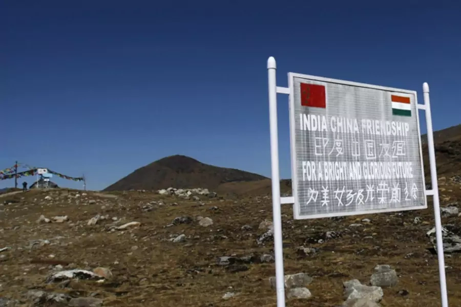 A signboard is seen from the Indian side of the Indo-China border at Bumla, in the northeastern Indian state of Arunachal Pradesh, November 11, 2009 (Courtesy Reuters/Adnan Abidi).