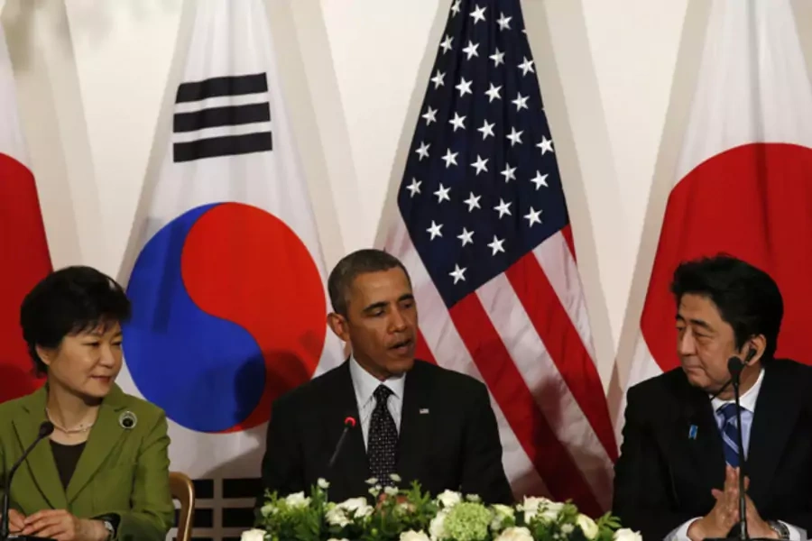 U.S. President Barack Obama holds a tri-lateral meeting with President Park Geun-hye of the South Korea (L) and Prime Minister Shinzo Abe of Japan (R) after the Nuclear Security Summit in The Hague March 25, 2014