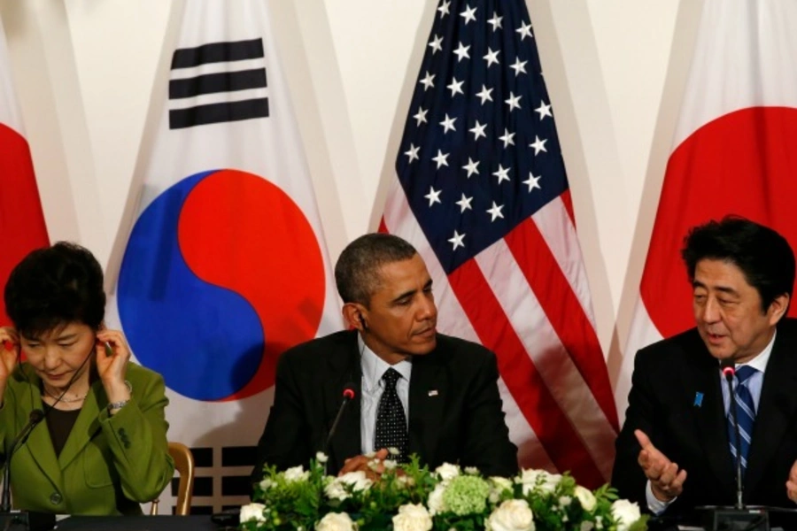 U.S. President Barack Obama holds a trilateral meeting with President Park Geun-hye of the South Korea (L) and Prime Minister Shinzo Abe of Japan (R) after the Nuclear Security Summit in The Hague on March 25, 2014. (Kevin Lamarque/Courtesy Reuters)