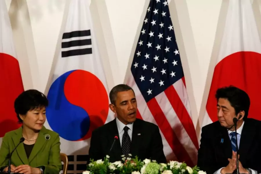 park-obama-abe-at-the-hague