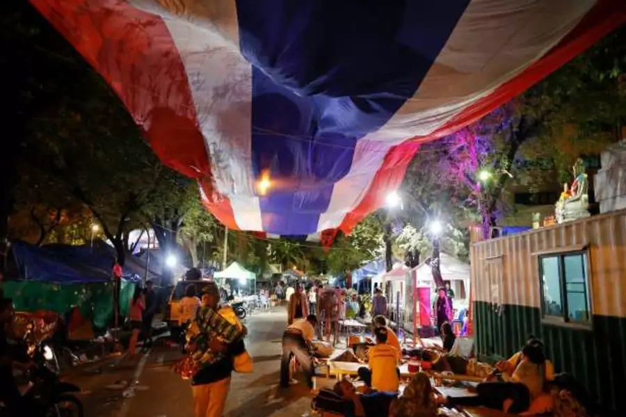 Anti-government protesters get ready to leave their main encampment after a military coup was declared in Bangkok on May 22, 2014 (Damir Sagolj/Courtesy Reuters).