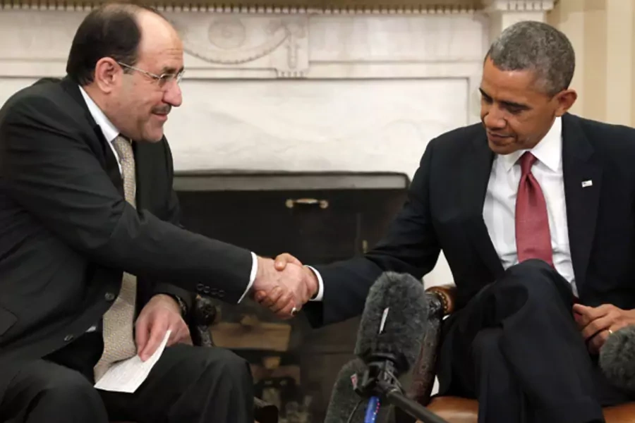U.S. President Barack Obama (R) shakes hands with Iraq's Prime Minister Nouri al-Maliki (L) after their meeting in the Oval Office at the White House in Washington, November 1, 2013 (Jonathan Ernst/Courtesy Reuters).