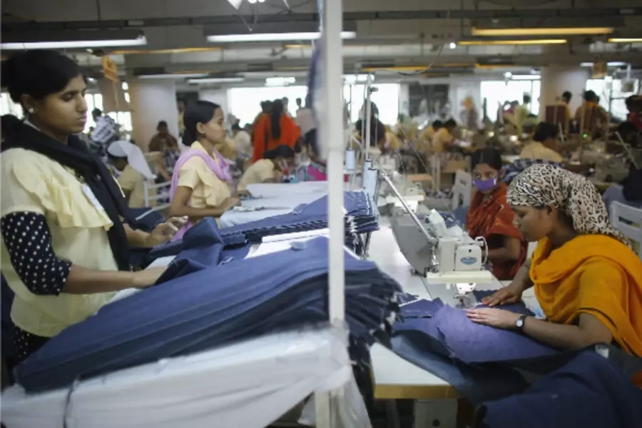 Employees work in a factory of Babylon Garments in Dhaka January 3, 2014 (Andrew Biraj/Courtesy: Reuters)
