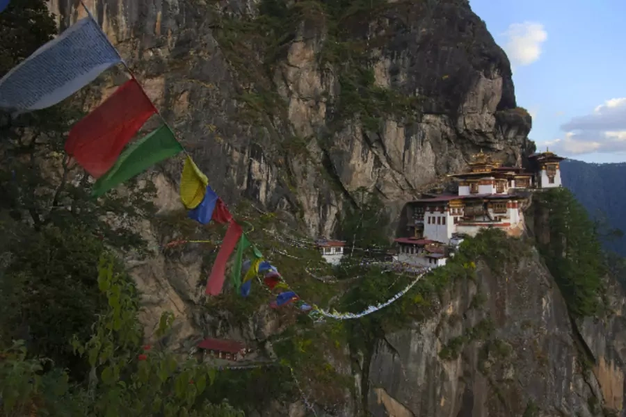 File photo: Prayer flags hang near the ParoTaktsang Palphug Buddhist monastery, also known as the Tiger's Nest, in Paro district, Bhutan on October 16, 2011 (Adrees Latif/Courtesy: Reuters).