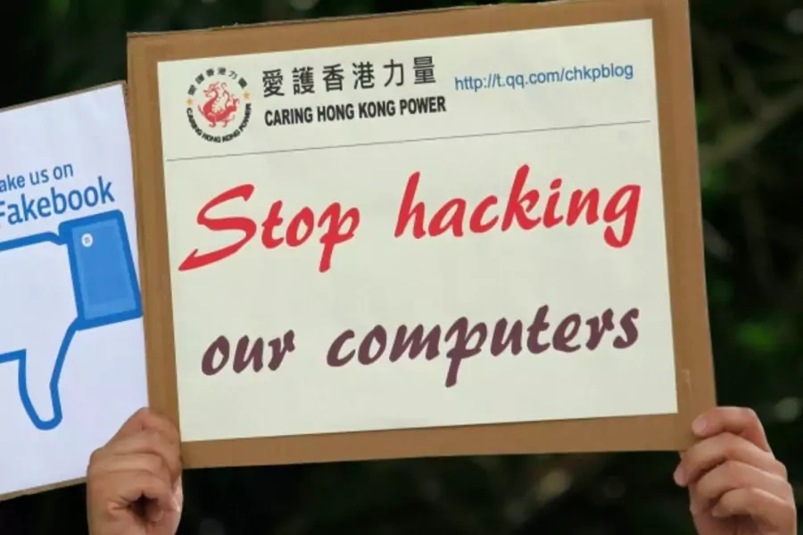A demonstrator from the pro-China "Caring Hong Kong Power" group protests over claims from former U.S. spy agency contractor E...cked computers in the Chinese territory, outside the U.S. Consulate in Hong Kong July on 9, 2013. (Bobby Yip/Courtesy Reuters)