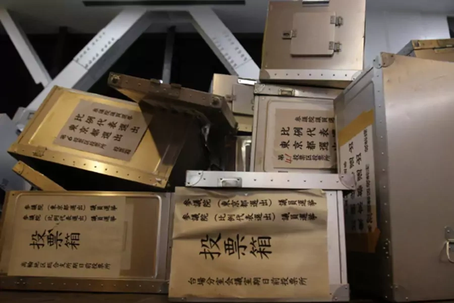 Empty voting boxes are seen at a ballot counting center for the upper house election in Tokyo July 21, 2013