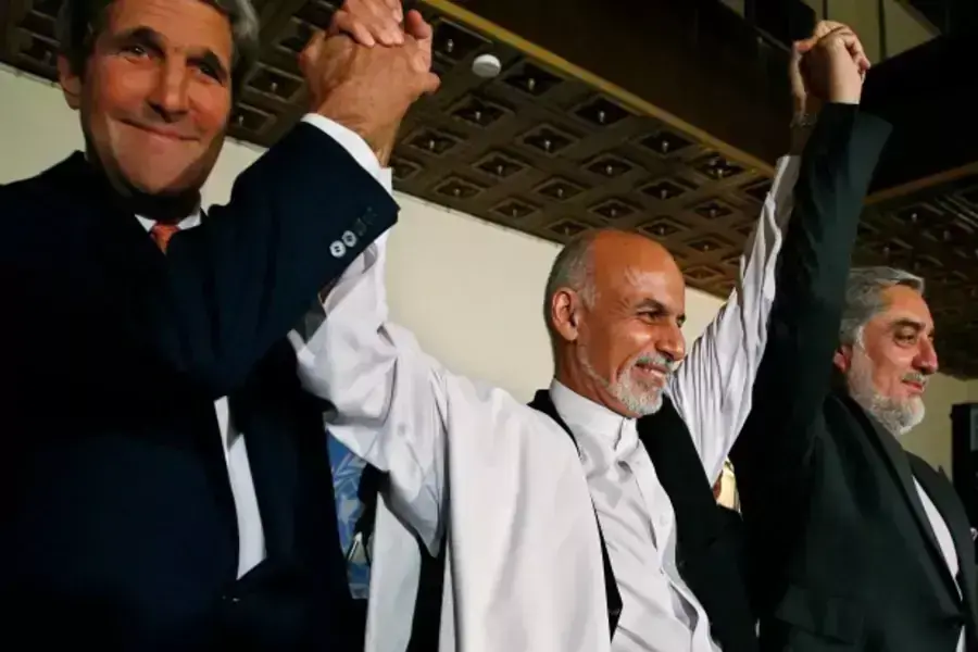 U.S. Secretary of State John Kerry (L) and Afghanistan's presidential candidates Ashraf Ghani (C) and Abdullah Abdullah hold t... the auditing of all Afghan election votes at the United Nations Compund in Kabul, July 12, 2014 (Courtesy Reuters/Jim Bourg).