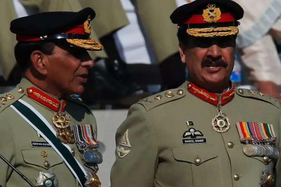 Pakistan's newly appointed army chief General Raheel Sharif (R) and outgoing army chief General Ashfaq Kayani (L) talk during ...army, with a formal handover from General Ashfaq Kayani on Friday. REUTERS/Mian Khursheed (PAKISTAN - Tags: POLITICS MILITARY)