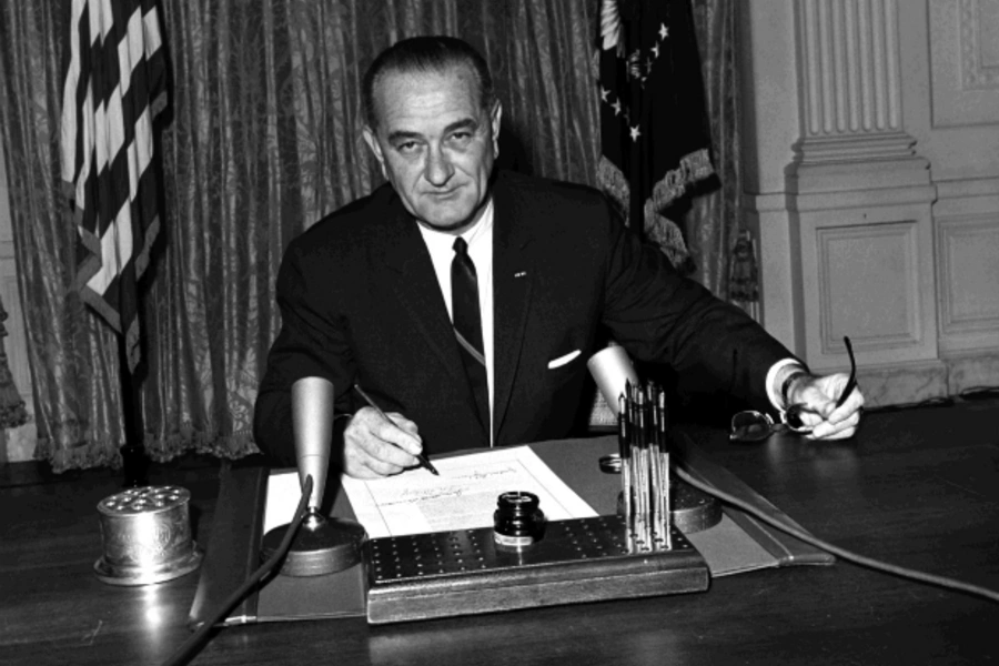 President Johnson signs "Gulf of Tonkin" Resolution