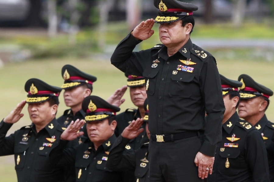 Thailand's newly appointed prime minister, Prayuth Chan-ocha (front), reviews honor guards on the outskirts of Bangkok on August 21, 2014 (Chaiwat Subprasom/Courtesy Reuters).