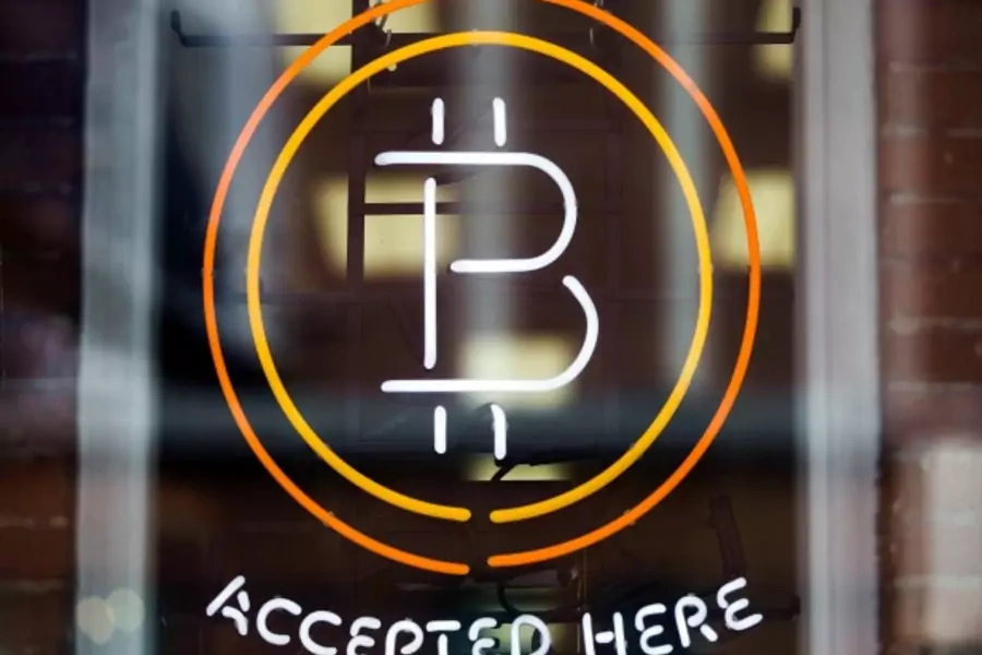 A Bitcoin sign is seen in a window in Toronto, Canada, May 2014 (Courtesy Reuters/Mark Blinch).