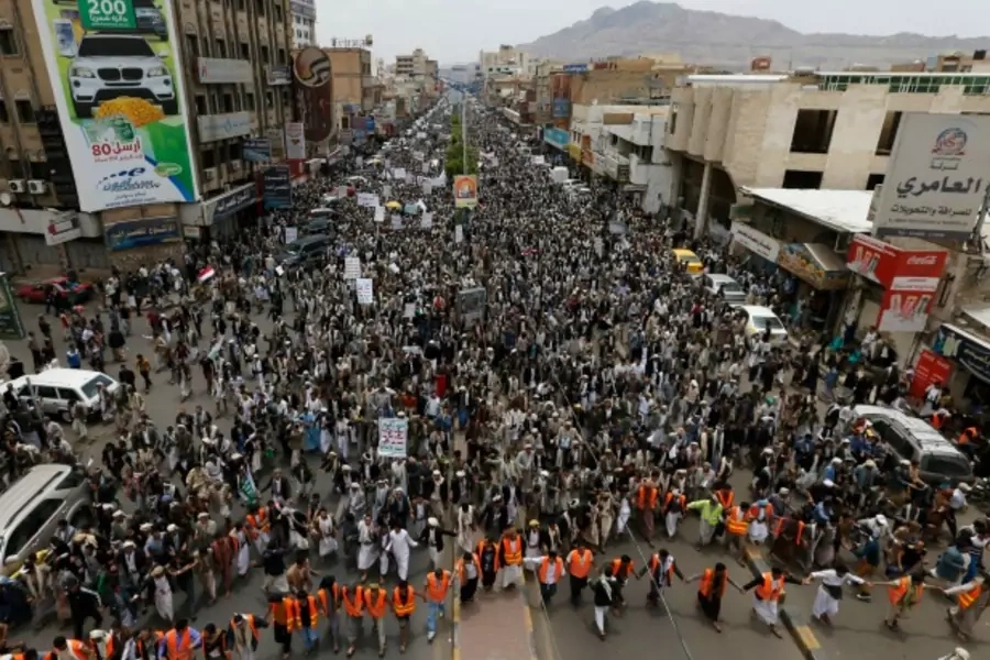 Anti-government protesters march during a demonstration to denounce fuel prices hikes in Sanaa, Yemen, August 4, 2014 (Courtesy Reuters/Khaled Abdullah).
