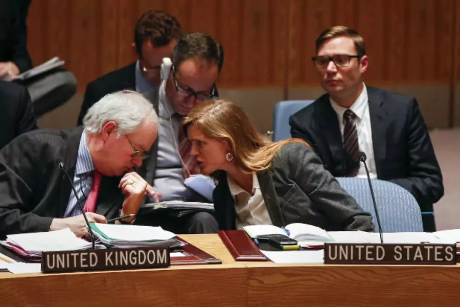 UK Ambassador to the UN Mark Lyall Grant speaks with his U.S. counterpart, Ambassador Samantha Power, during a UN Security Council meeting on the crisis in Ukraine in March 2014.