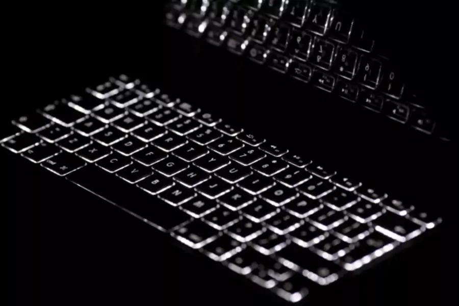 Backlit keyboard is reflected in screen of Apple Macbook Pro notebook computer in Warsaw on February 6, 2012. (Kacper Pempel/Courtesy Reuters)