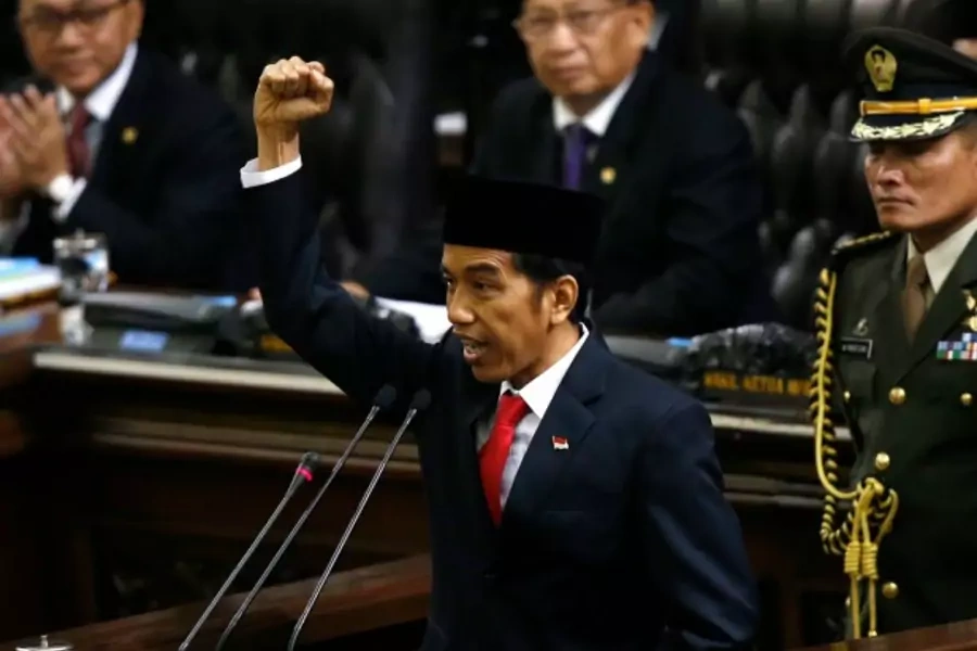 Indonesia's new President Joko Widodo shouts "Merdeka" or Freedom at the end of his speech, during his inauguration at the Hou...o test the former furniture businessman. REUTERS/Darren Whiteside (INDONESIA - Tags: POLITICS ELECTIONS TPX IMAGES OF THE DAY)