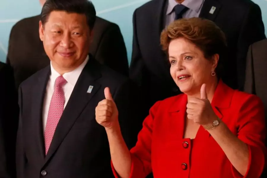 China's President Xi Jinping (L) and Brazil's President Dilma Rousseff attend the official photo session for the meeting of Ch...meeting of China and Community of Latin American and Caribbean States (CELAC). REUTERS/Sergio Moraes (BRAZIL - Tags: POLITICS)