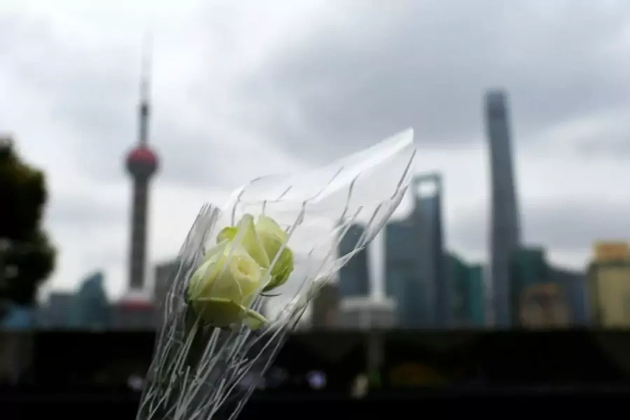 A bouquet of flowers is pictured at the site of a memorial ceremony for people who were killed in a stampede incident last Wed... people and dented the city's image as modern China's global financial hub. REUTERS/Aly Song (CHINA - Tags: DISASTER BUSINESS)