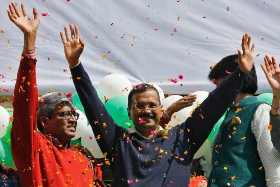 Aam Aadmi (Common Man) Party (AAP) chief and its chief ministerial candidate for Delhi, Arvind Kejriwal (center), waves to his supporters in New Delhi on February 10, 2015 (Adnan Abidi/Courtesy Reuters).