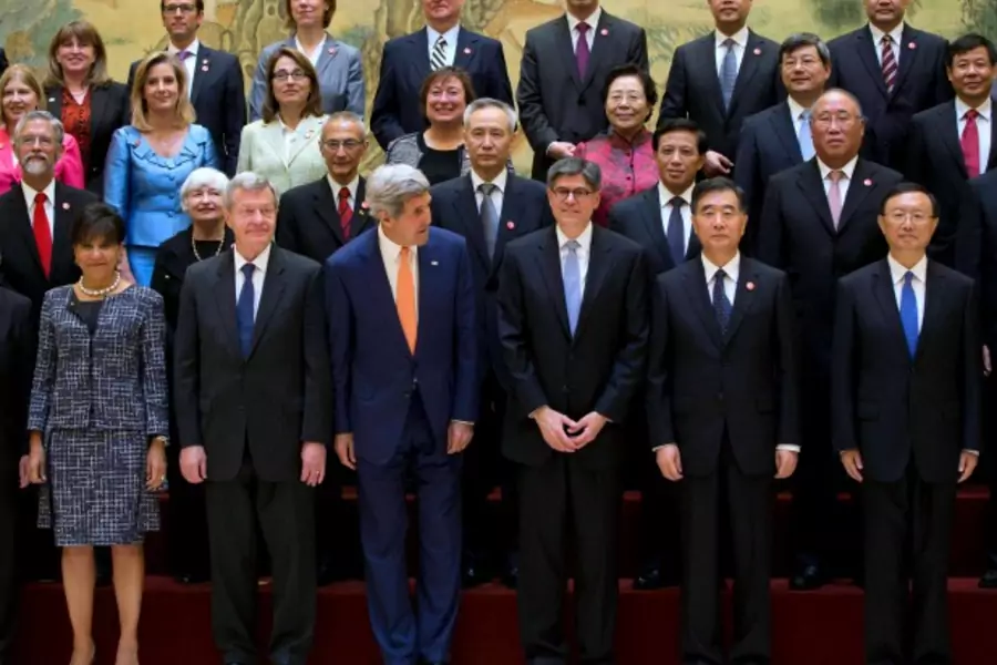 U.S. Secretary of State John Kerry (centre L) and U.S. Treasury Secretary Jack Lew (centre R) pose for a group photo with Chin...ic Dialogue, "S&ED" at the Diaoyutai State Guesthouse in Beijing July 9, 2014. REUTERS/Andy Wong/Pool (CHINA - Tags: POLITICS)