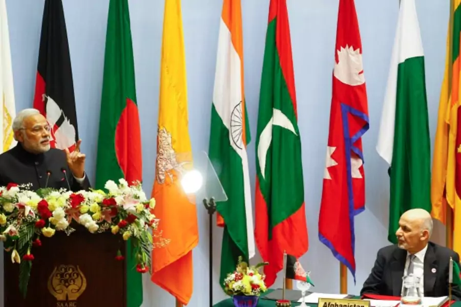 India's Prime Minister Narendra Modi (L) speaks as Afghanistan's President Ashraf Ghani watches during the opening session of ...n for Regional Cooperation (SAARC) summit in Kathmandu, Nepal, on November 26, 2014 (Courtesy Narendra Shrestha/Pool/Reuters).