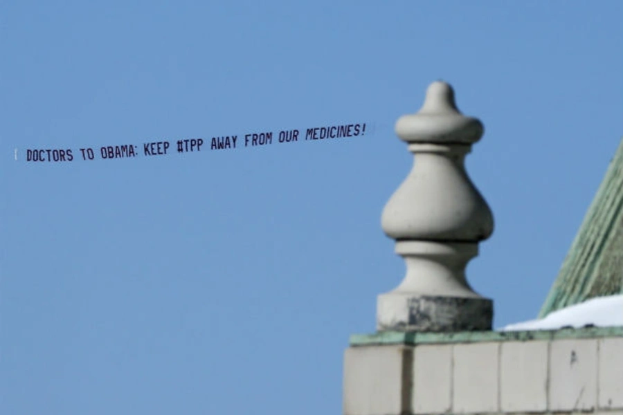 An aerial banner reading "Doctors to Obama: Keep #TPP Away from Our Medicines!" flies above New York in January 2015. The bann...h has argued that the Trans-Pacific Partnership could restrict access to affordable generic medicines in developing countries.