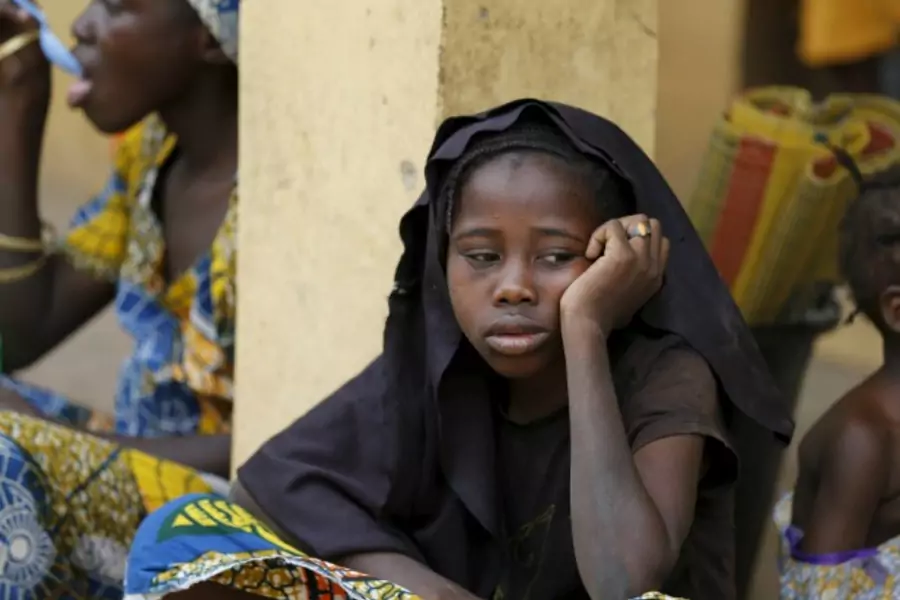 A girl who was freed by the Nigerian army from Boko Haram militants in the Sambisa forest looks on at the Malkohi camp for internally displaced people in Yola, Nigeria, May 3, 2015 (Afolabi Sotunde/Courtesy Reuters).