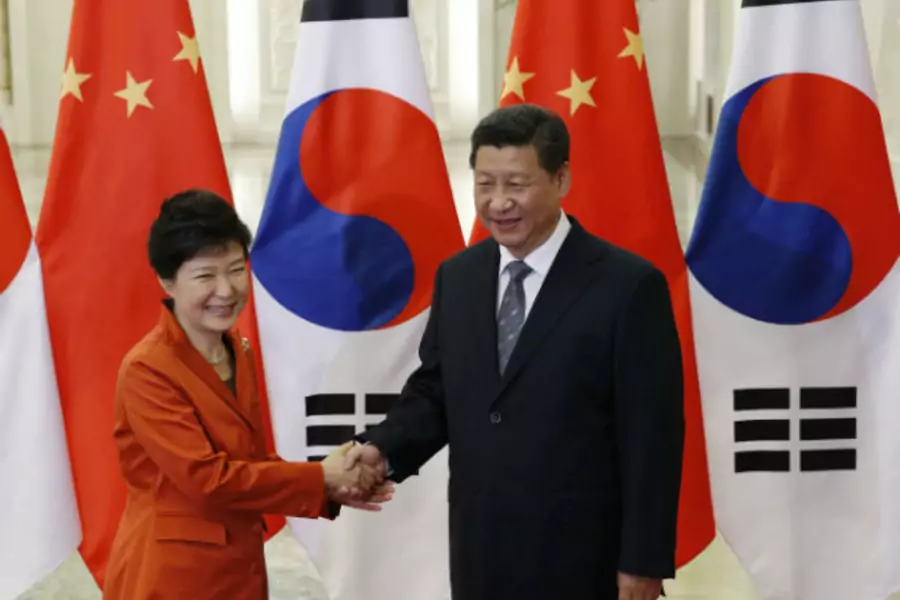 South Korean President Park Geun-hye shakes hands with Chinese President Xi Jinping on the sidelines of the Asia-Pacific Economic Cooperation (APEC) summit in Beijing, China, on November 10, 2014.